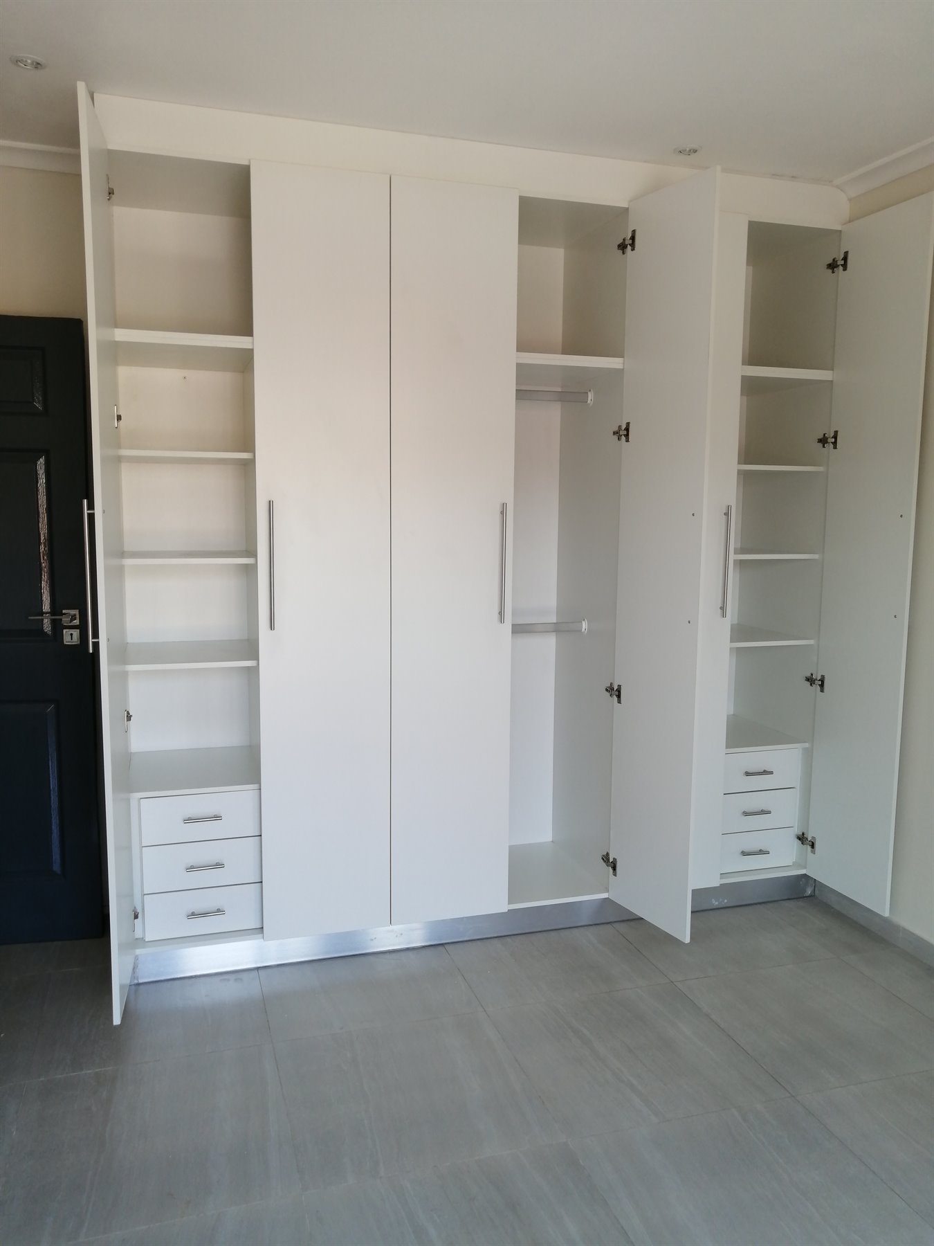 White built-in wardrobe shelving