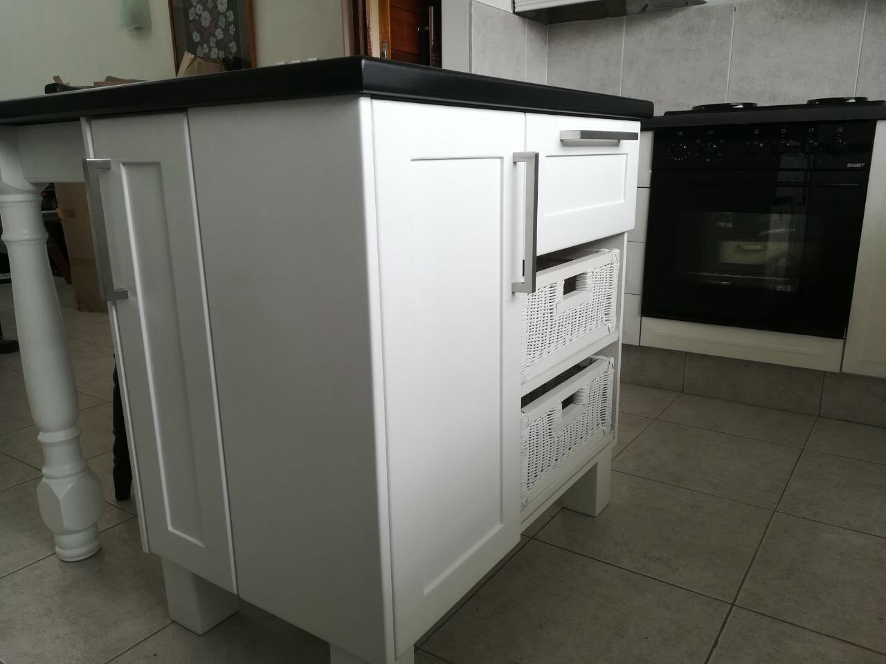 White kitchen island with appliance storage