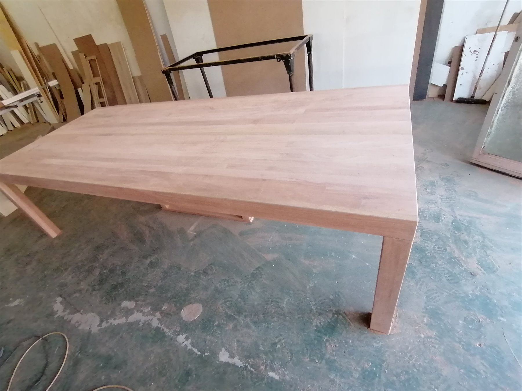 Light solid wood table in the workshop