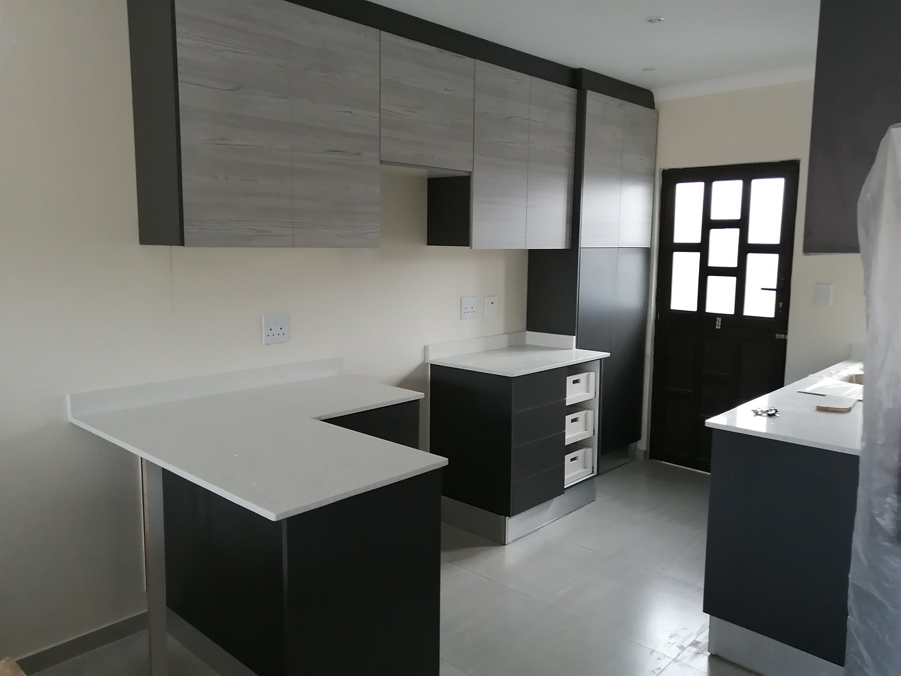 Two-tone melamine kitchen cupboards