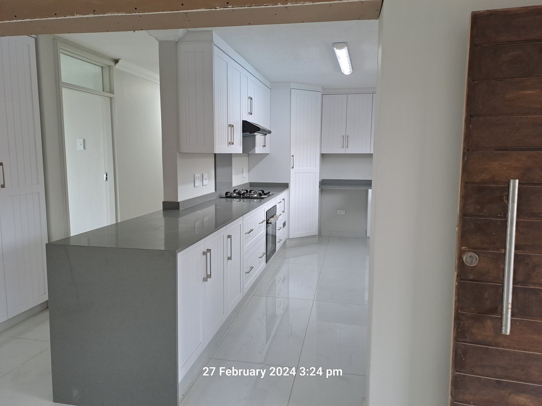 Supawood kitchen with white cabinetry
