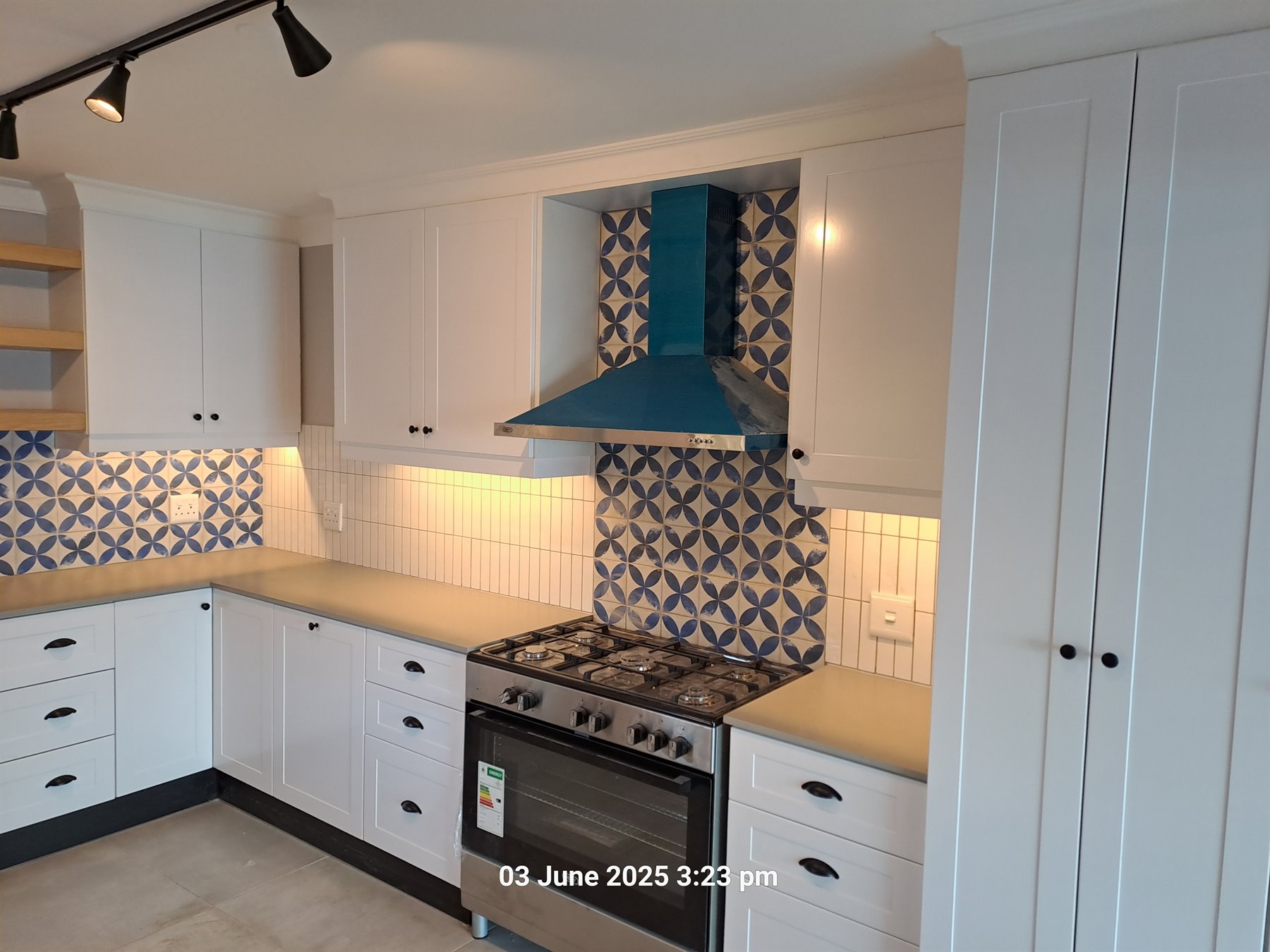Supawood kitchen with patterned splashback