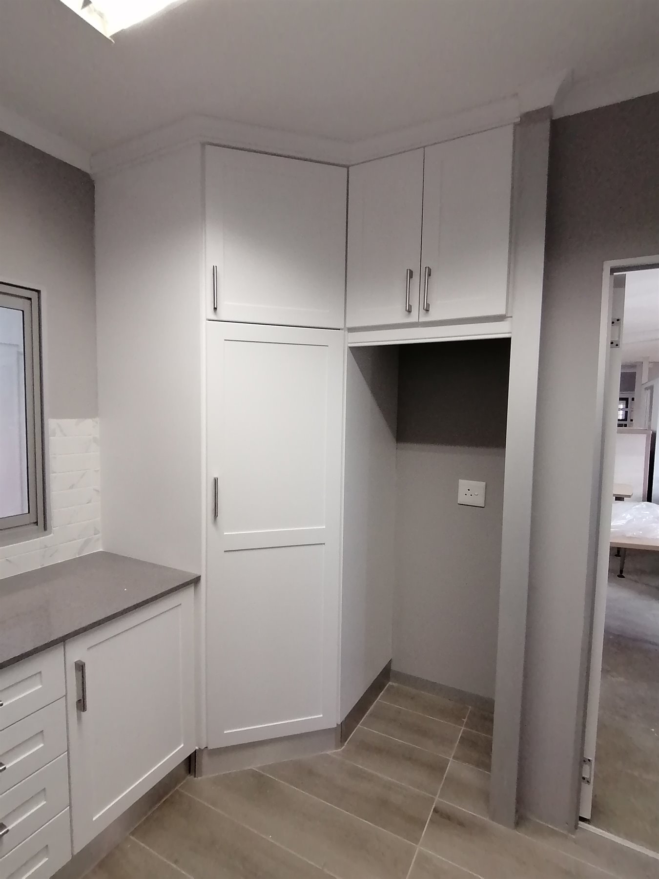 Tall fitted kitchen pantry cabinetry