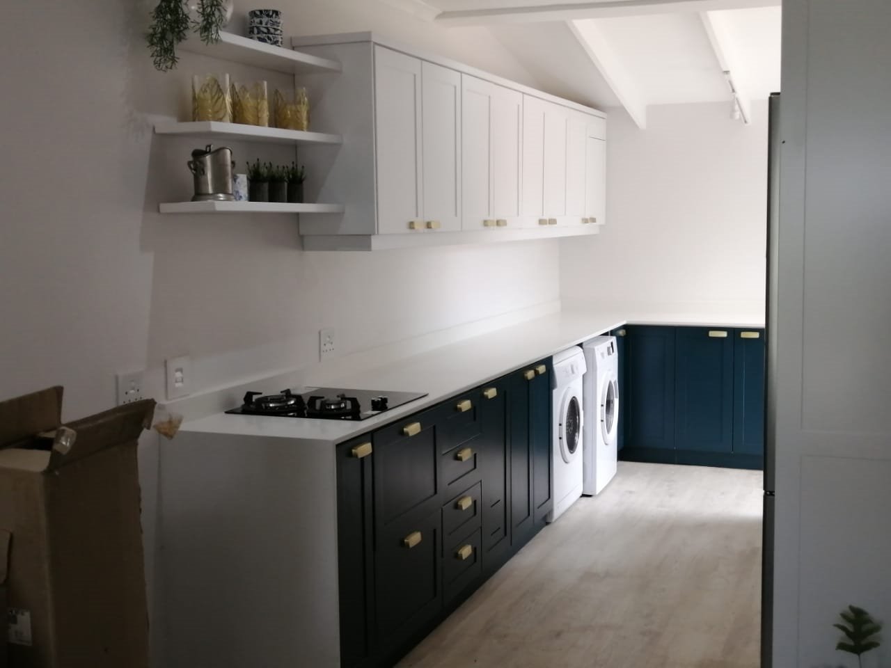 Blue and white fitted kitchen cabinetry