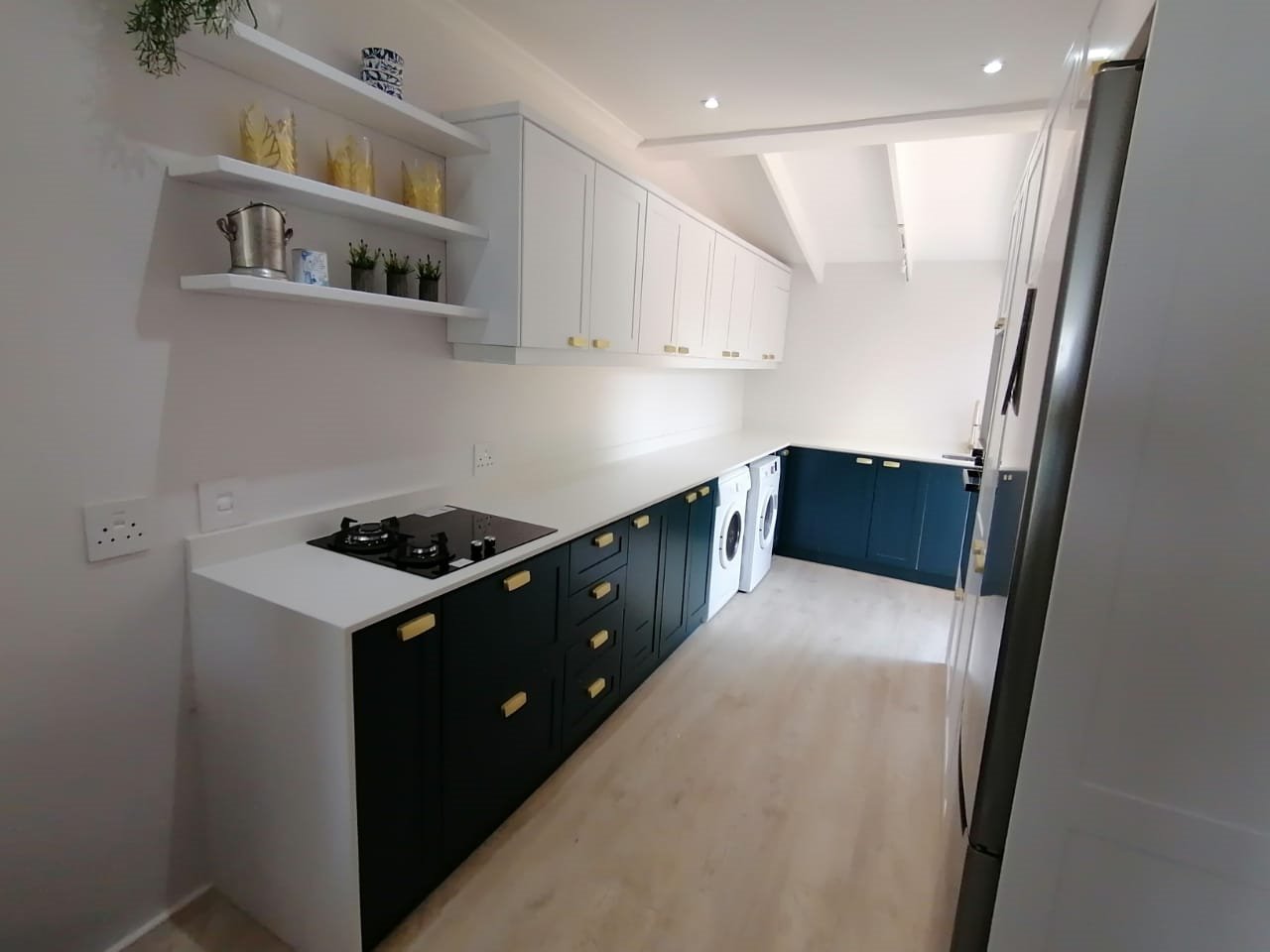 Modern blue and white fitted kitchen cabinetry