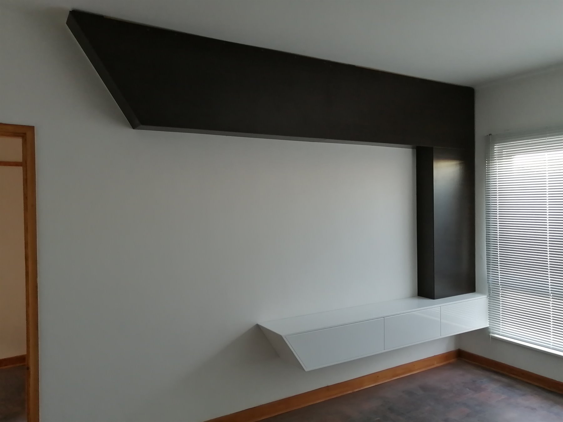 Black floating TV feature panel