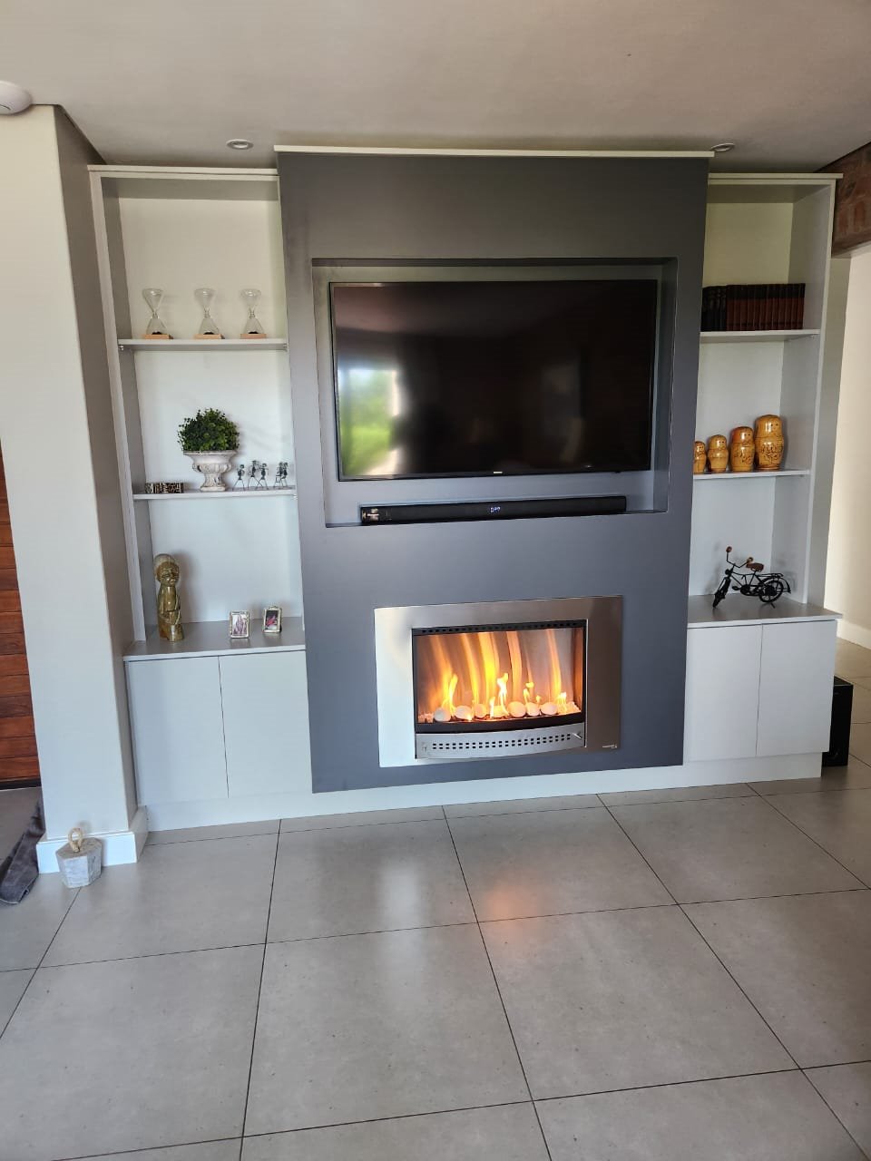TV and fireplace feature wall with storage
