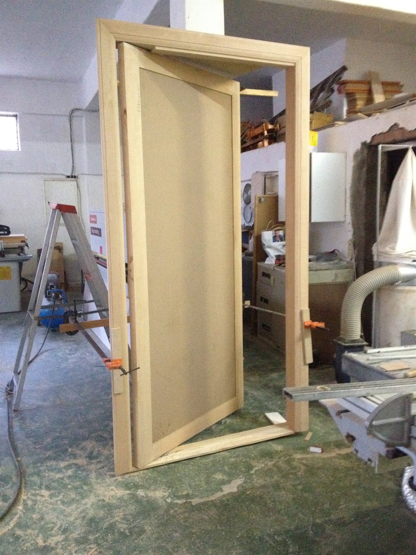 Entrance door frame in the workshop