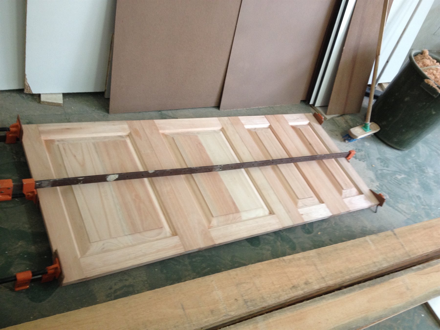 Solid raised panel doors being clamped