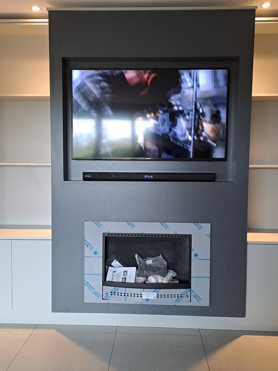 Custom living room TV feature wall and fireplace unit