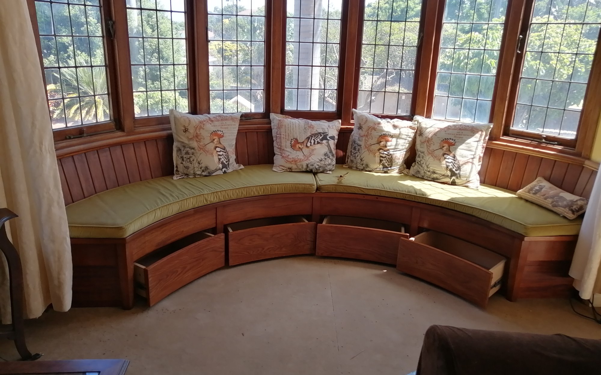 Curved built-in seating with storage by 2G Custom Furniture