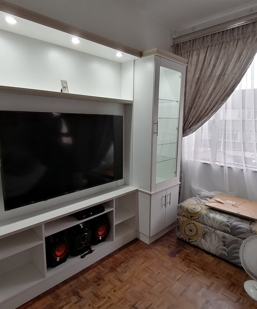 Custom living room wall unit with TV and fireplace